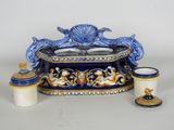 a blue and white table with a candle holder and two candles