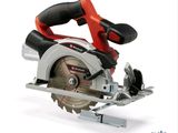 a close up of a circular saw on a white surface
