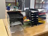 a desk with a lot of boxes on top of it
