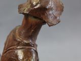 a statue of a dog with a hat on it ' s head