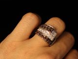 a woman ' s hand with a ring on her finger