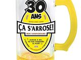 a beer glass with a yellow handle and a yellow handle