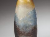 two vases that are sitting on a table