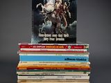 books stacked on top of each other on a black surface