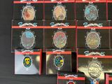 a lot of different badges on a black table