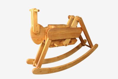 a wooden rocking horse on a white background