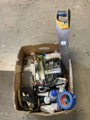 a box full of tools sitting on the floor