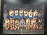 a picture of a basketball team that is hanging on the wall