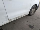 a white van that is parked on the side of the road