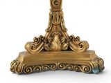 a gold table with a clock on top of it