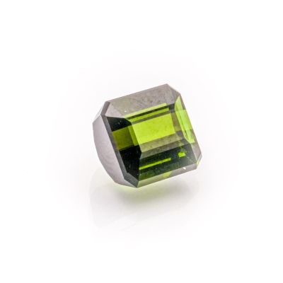 a green tourmaline stone on a white background