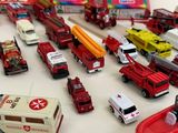 many different types of toy cars and trucks on the table