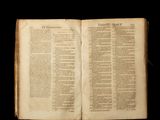 an old open book with a black background and a black background