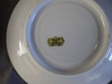 a white plate with a small piece of food on it