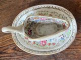 a small cup and saucer sitting on a wooden table