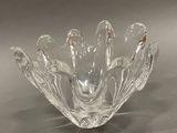 a glass bowl that is sitting on a table