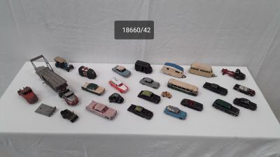 a lot of toy cars that are on a table