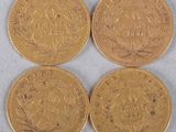 three gold sovereigns, one of which has a crown and the other of which is a crown