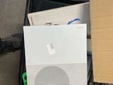 a box that has a speaker and a box with some papers