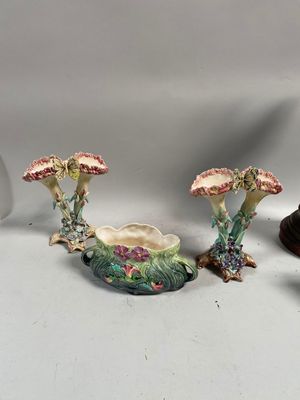 three different types of vases sitting on top of a white table