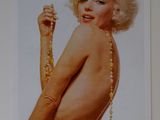 a picture of a woman with a necklace on her neck