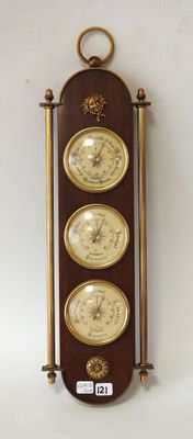 three clocks mounted on the wall of a room