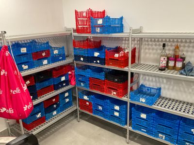 many baskets on the shelves in the store