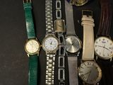 a lot of watches that are sitting on a table