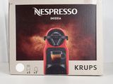 nespresso krups coffee machine in a box on a table