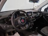 the interior of a small car with a steering wheel and dashboard