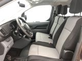 the interior of a car with a steering wheel and leather seats