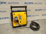 a yellow and black portable air compressor sitting on top of a table
