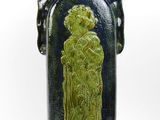 a blue vase with a green design on it
