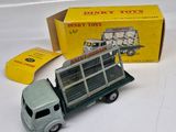 a toy truck that is sitting next to a box of dinky toys