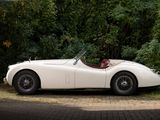 a white sports car parked on the side of the road