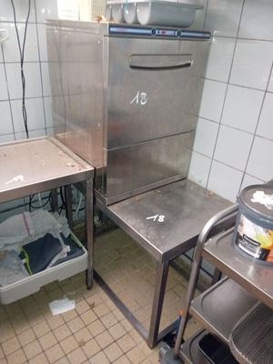 a small kitchen with a sink and a stove in it