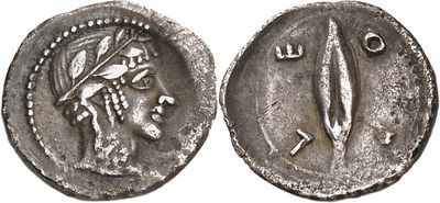 a silver coin with an image of a woman holding a sword