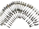 many forks and spoons arranged in the shape of a circle