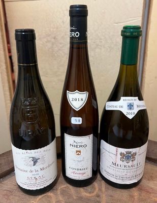 three bottles of wine sitting on a table next to each other