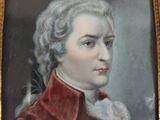 portrait of a man in a red coat and white collared shirt