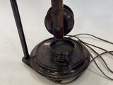 a close up of a lamp on a table with a cord