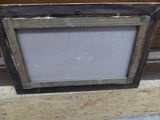 a picture of a picture frame sitting on a piece of plywood wood
