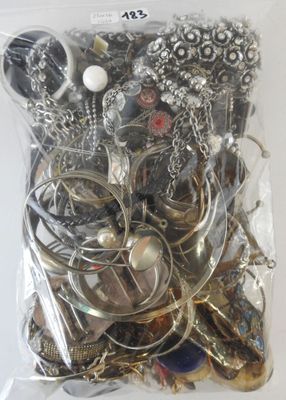a bag of assorted silver and gold jewelry