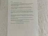 a piece of paper on the table with a piece of paper attached to it