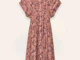 an image of a woman ' s dress on a hanger