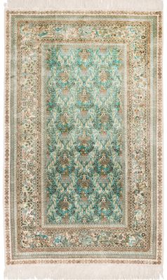 un tapis bleu et vert orné d'un motif en médaillon