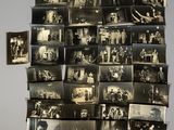 several old black and white photographs of people on a wall