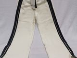 white pants with black stripes on them on a white surface