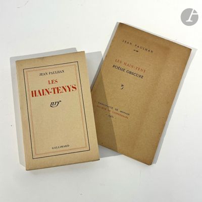 two books sitting next to each other on a white surface