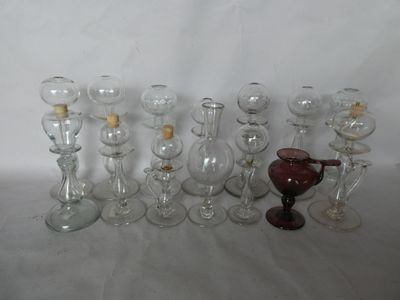 a lot of wine glasses that are sitting on a table